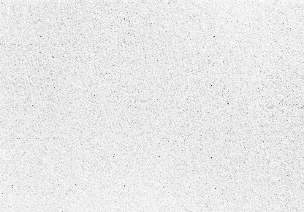 a black and white photo of a snow covered ground